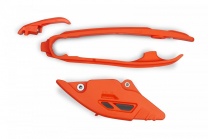 UFO plast Vodítko reťaze zadné + predné KTM SX/SX-F 23-, EXC/EXC-F 2024-, HUSQVARNA FC 23-, FE 24-, GAS GAS 24- oranžové