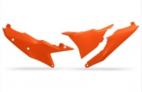 UFO plast Tabuľky zadné s krytom airboxu (ľavý) KTM SX/SX-F 23-, EXC/EXC-F 24- oranžové